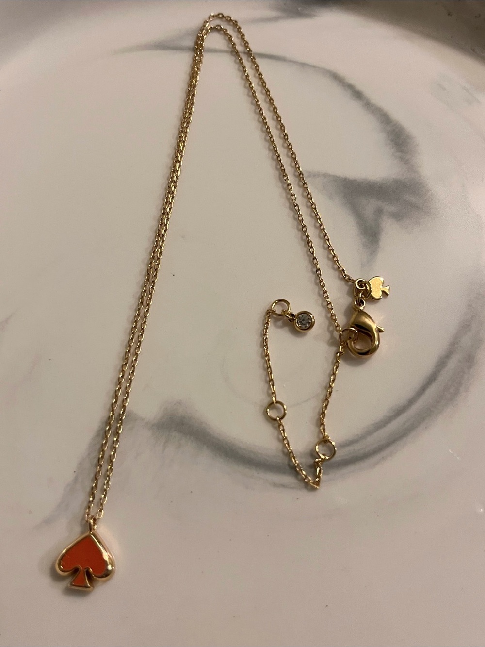 kate spade gold necklace with orange spade pendant